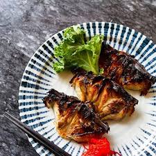 Maneki signature dishes Black Cod Collars, Nabemono (hot pot), and a selection of classic sushi and sashimi.